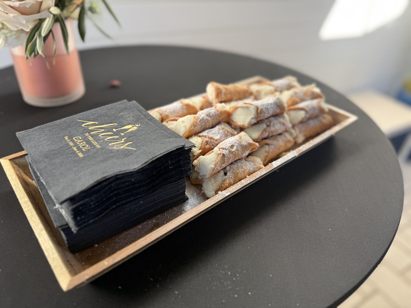 Cannoli arranged on a serving board for an Italian Brothers celebration