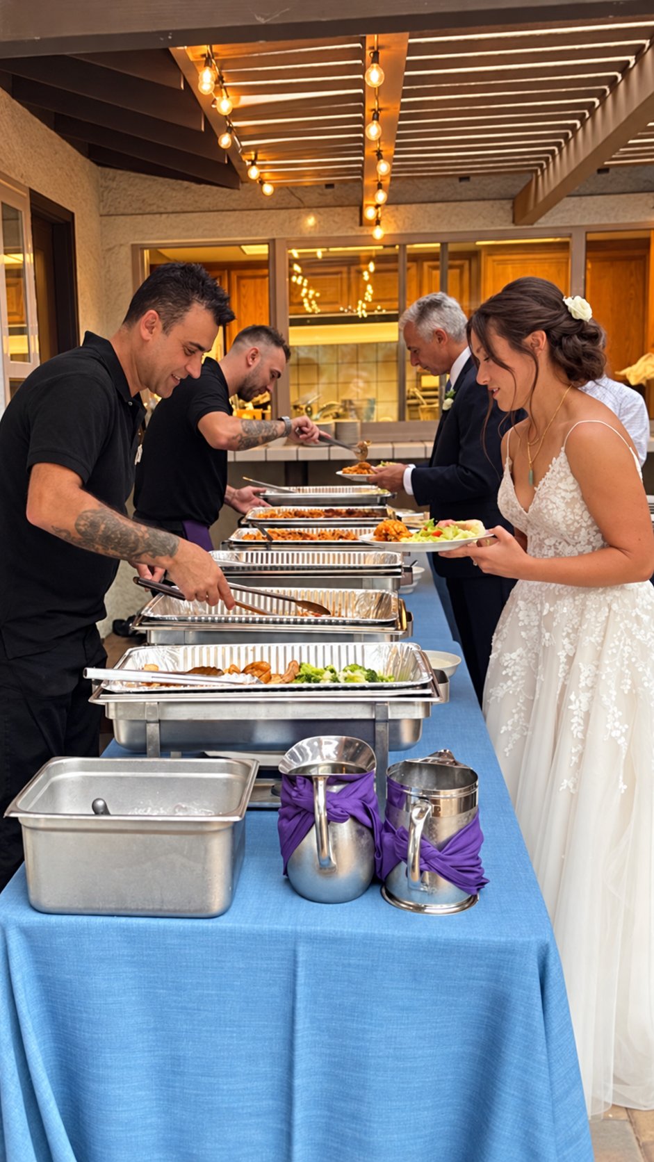 Italian Brothers team serving the bride and groom at a wedding buffet