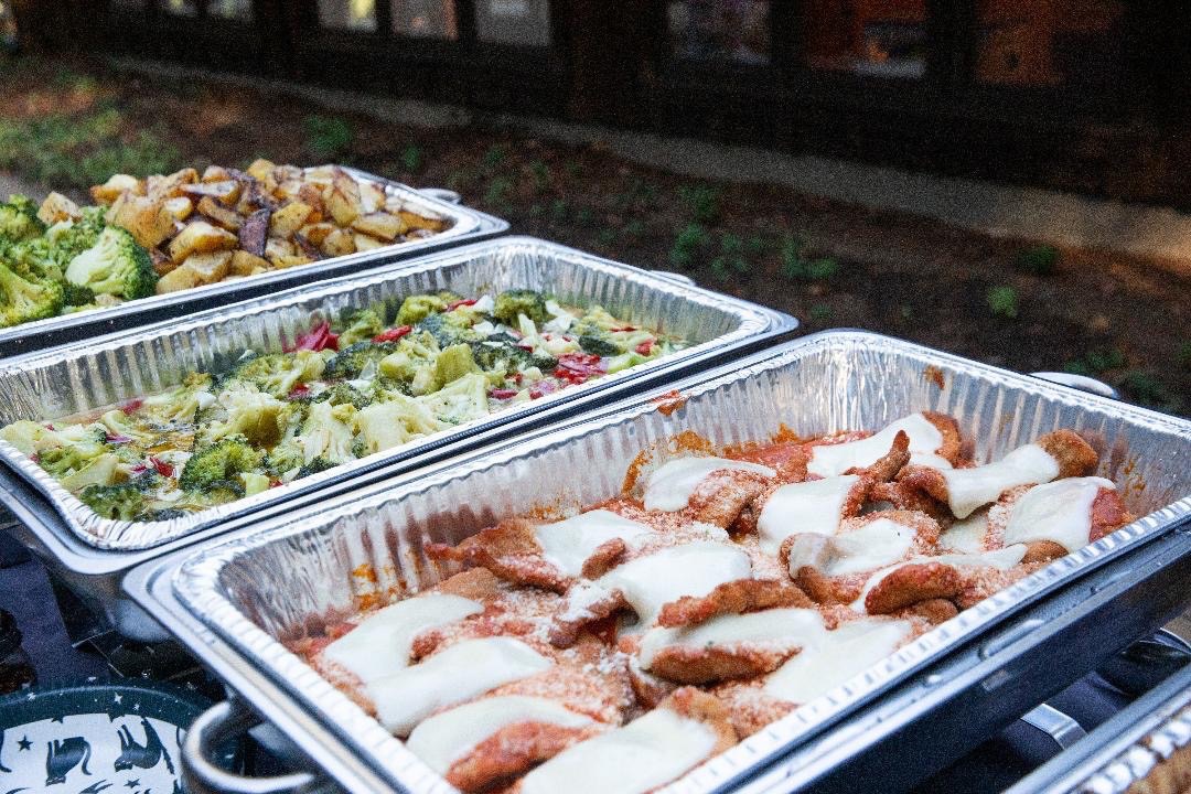 Italian Brothers hot buffet with baked entrées and vegetables