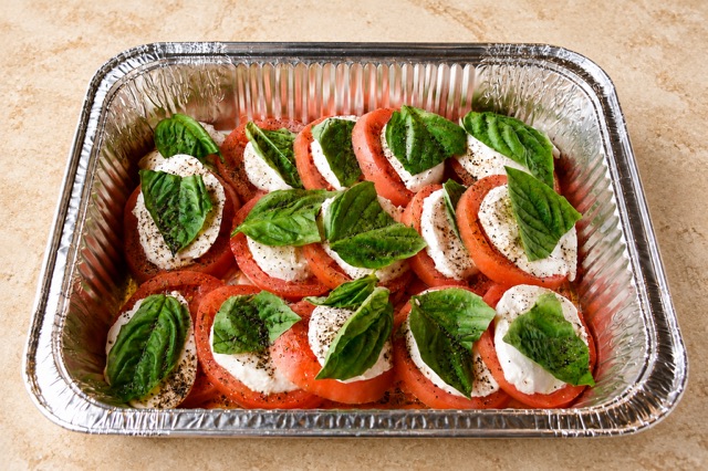 Caprese party tray with tomatoes, mozzarella and basil