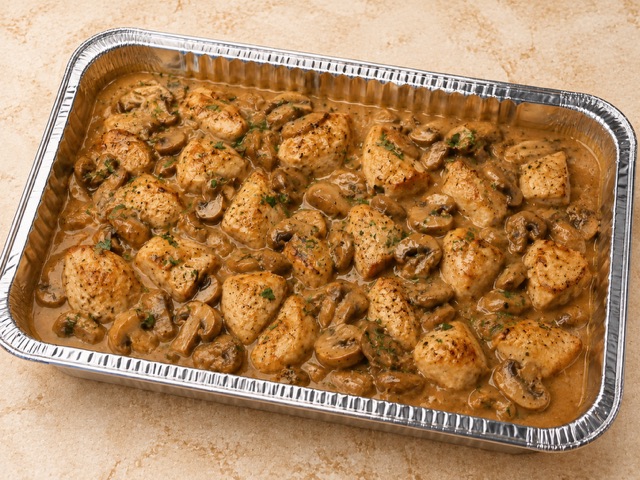 Chicken Marsala served in a party tray